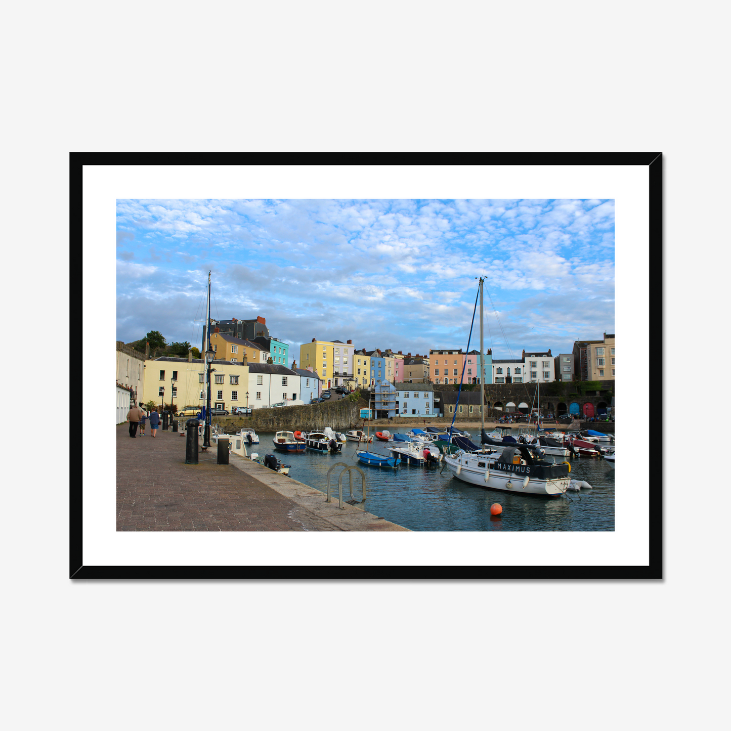 Framed photo of a harbour scene with colourful buildings and boats under a blue sky
