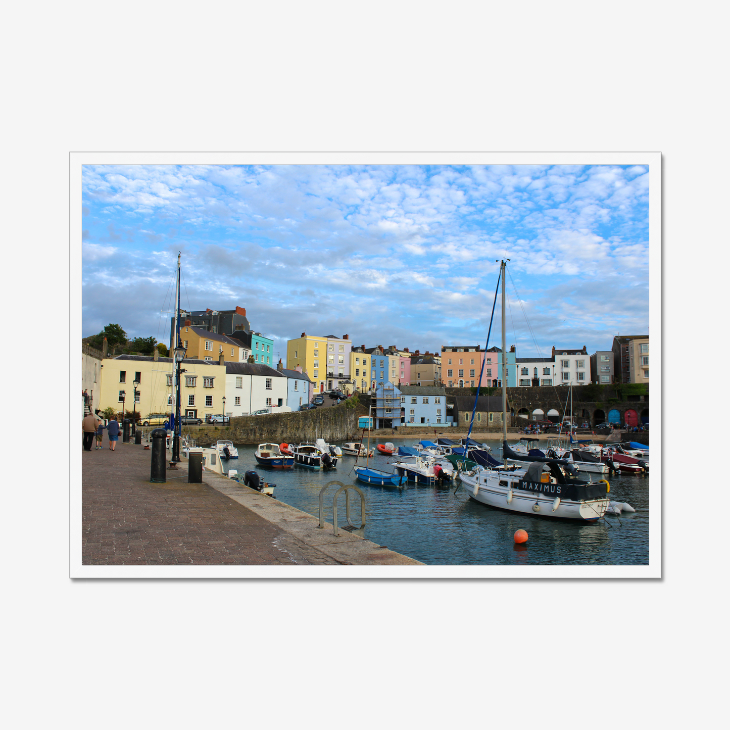 Framed photo of a harbour scene with colourful buildings and boats under a blue sky