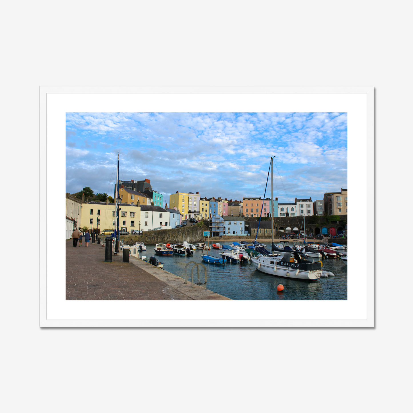 Framed photo of a harbour scene with colourful buildings and boats under a blue sky