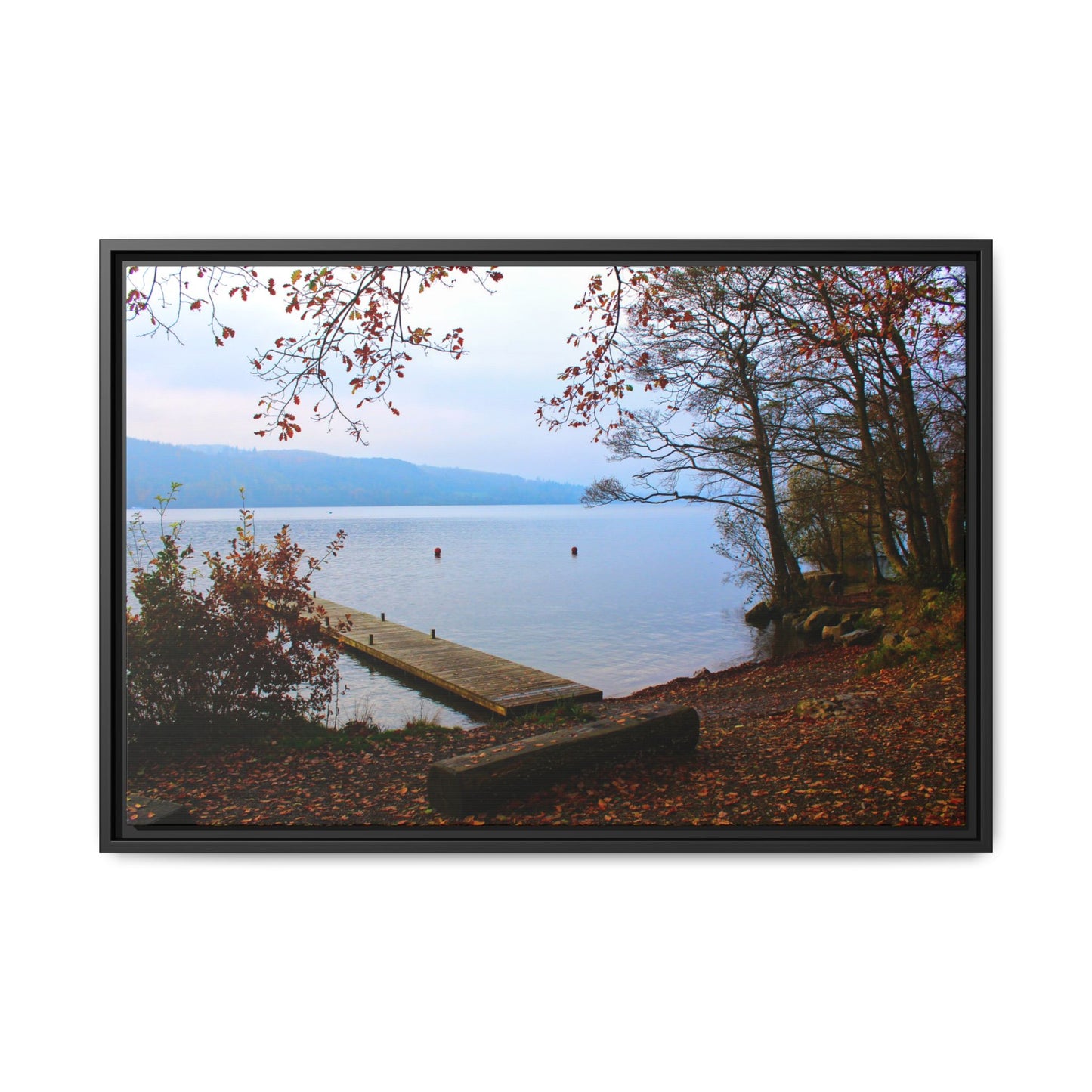 Framed picture of a lake scene with a dock and autumn foliage.