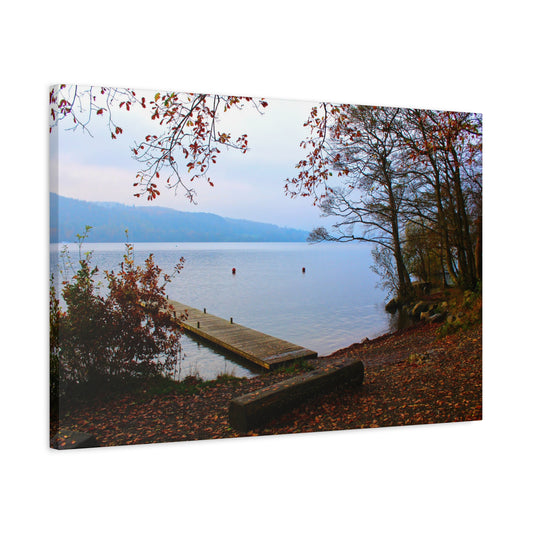 Canvas print of a lake scene with a wooden dock and autumn foliage.