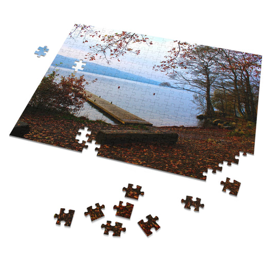 Jigsaw puzzle with a scenic view of a lake and trees, with missing pieces.
