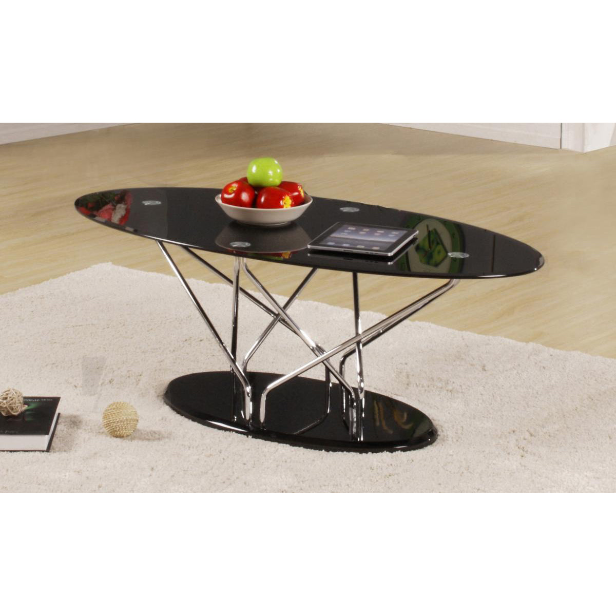 Modern black glass coffee table with chrome legs on a beige carpet