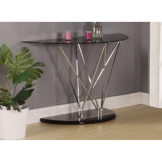 A black glass console table with chrome legs, displayed in a room setting with decorative items on top.