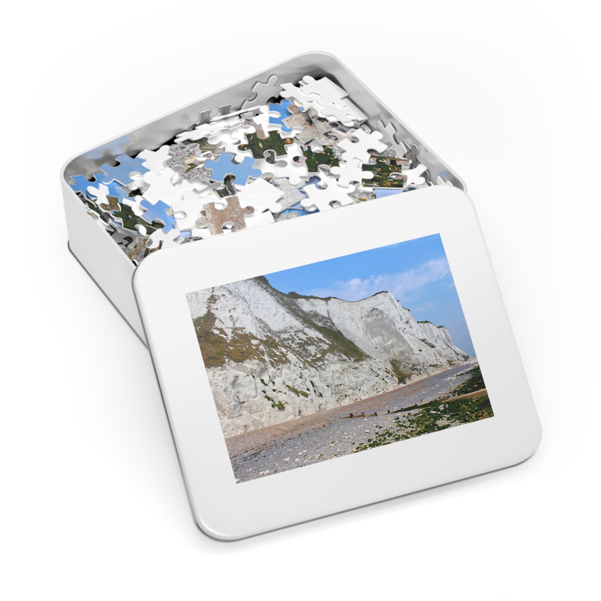 Jigsaw puzzle in a tin with a scenic picture on the lid